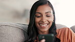 Woman, phone and smile for social media on living room sofa in communication, texting or chatting at home. Happy female relaxing and smiling on smartphone for networking, browsing or chat on couch