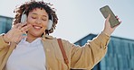 Headphones, phone and black woman in city dancing to music in outdoor lens flare for student lifestyle and wellness. Urban, gen z person dance and listening to audio tech on mobile app, 5g smartphone