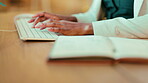 Business woman, hands and writing notes or typing on computer for record keeping or planning at office desk. Hand of planner taking note in book working on PC keyboard for data entry or information