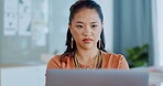 Thinking, laptop and focus with a business asian woman at work in her office on an email, review or report. Idea, computer and serious with a female employee working on research at her desk