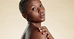 Skincare, beauty and black woman touch shoulder for self care, wellness and cosmetics on studio background. Dermatology, spa aesthetic and portrait of African girl with glow, facial and natural skin