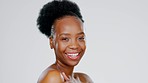 Beauty, laughing and portrait of a black woman with a glow isolated on grey studio background. Skincare, smile and face of African girl with self love, glowing treatment and cosmetic care on backdrop