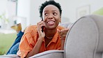 Relax, phone call and black woman on couch, communication and resting in living room. African American female, lady and smartphone for discussion, connection with contact and break on sofa in lounge