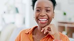 Happy, face and black woman laughing on a sofa, relax and cheerful against blurred background. Portrait, smile and female chilling in living room, carefree and peaceful on off day or weekend at home