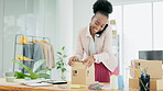 Black woman, logistics and phone call packing box for shipping, product delivery or ecommerce order. Happy African American female small business owner on smartphone preparing for courier service