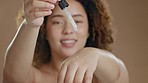 Skincare, serum and face of black woman in studio for essential oil, treatment and brown background. Hyaluronic acid, portrait and girl with facial, skin or beauty, routine or collagen while isolated