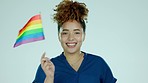 Face, woman and rainbow flag in studio for pride support, lgbtq choice and advocate of transgender human rights. Portrait, happy female model and homosexual freedom of queer, lesbian and gay equality