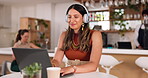 Laptop, music and coffee shop with a freelance woman streaming audio while remote working online. Computer, freelancer and headphones with a female entrepreneur listening to the radio in a cafe