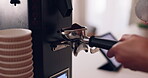 Hands, barista and coffee machine with an employee working behind a kitchen counter in a cafe for service. Waiter, cafeteria and caffeine with a person making a drink at work in a restaurant