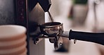 Coffee machine, barista hand and grind beans in cafe, closeup and prepare latte or espresso drink with service. Hot beverage, person working in restaurant and brewing process, premium blend caffeine