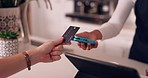 Pos, hands of woman and payment with credit card in coffee shop with barista at counter with financial freedom. Future, technology and customer paying for service in cashless tap transaction at cafe.