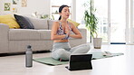 Yoga, meditation and woman with tablet in online class, fitness or workout for home, holistic health and wellness. Asian person with praying hands, namaste or pilates training in lounge web tutorial 