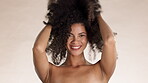 Beauty, curly hair and face of black woman in studio for self love, confidence and natural. Cosmetics, salon and glow with girl model for satisfaction, self care and happiness on brown background