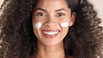 Skincare, beauty and face cream by black woman in studio for facial, mask or moisturizing wellness. Portrait, sunscreen and skin product by happy model satisfied with application, treatment or result