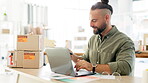 Laptop, phone call and logistics with a courier man at work in his office for the delivery of an order. Ecommerce, retail and sales with a male employee talking on his mobile for distribution