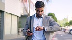 Time management, phone and businessman checking watch outdoors, walking to work, meeting or appointment. Punctual, male and ceo on social media while on commute, happy and smile on blurred background