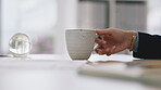 Coffee, cup and hand with a business woman or architect working on a blueprint in her office for design. Tea, mug and a female employee or designer drinking a beverage while planning at work