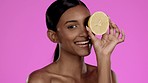 Beauty, skincare and Indian woman in studio with lemon, vitamin c cosmetics isolated on pink background. Natural makeup, organic dermatology and skin care model with spa or salon fruit detox facial.