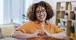 Portrait, heart and hand gesture with a woman, happy in her home for love, health or wellness. Smile, emoji and finger shape with an attractive young female making a sign or symbol of affection