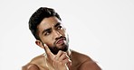 Thinking, confused and face of man in studio for wellness, skincare and hygiene on white background. Doubt, portrait and indian male model with unsure emoji contemplating beauty cosmetic or body care