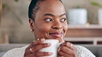 Happy black woman, home and thinking with coffee in lounge, living room and relax in apartment. Female, smile and drinking cup of tea, beverage and daydream for happiness, calm lifestyle or self care