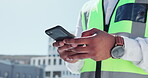 Phone, city and engineering man hands in building development update, mobile app chat or networking. Urban outdoor architecture, contractor or construction worker person typing on cellphone