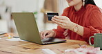 Woman hands, credit card and laptop for business online shopping, trading or fintech payment in office startup. Professional person typing bank information on computer for website loan or transaction