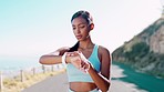 Fitness, tracker and woman in road with smart watch for heart rate, progress and timing during training run. Cardio, pulse and indian girl with tracking app for time, app and monitor during workout