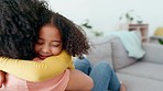 Love, mother and daughter hug, lounge and happiness on couch, cheerful and quality time. Happy, mama and daughter embrace, loving and bonding together, joyful and affection on sofa, relax and happy