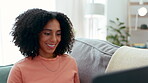 Laptop, smile and woman typing on sofa in home living room for online dating in house. Relax, computer and happy female professional, remote worker or freelancer writing, research or web browsing.