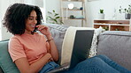 Smile, laptop and woman typing on sofa in home living room for online dating in house. Relax, computer and happy female professional, remote worker or freelancer writing, research or web browsing.