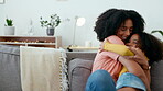 Mother, child and running for hug on sofa in home with love, care and support of black family. Woman and girl together for bonding, play and fun in house living room while happy with energy and smile