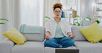 Woman, yoga and sofa by laptop in meditation tutorial, spiritual wellness training or streaming in living room at home. Calm female yogi in peaceful exercise or meditating by computer on lounge couch