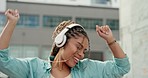 Woman, dancing and listening to music in the city with headphones for audio streaming in the outdoors. Happy female dancer enjoying 5G connection with headset to listen for sound track in urban town