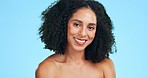 Smile, beauty and face of black woman for wellness, skincare and facial treatment on blue background. Dermatology, luxury spa and portrait of happy girl in studio for cosmetics, makeup and hair care