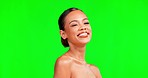 Green screen, beauty and woman in studio for makeup, body care and self love, happy and smile. Skincare, glowing and girl model relax with pamper, cosmetics and skin routine while laughing isolated