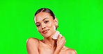 Beauty, gua sha and woman portrait on green screen background for skincare, cosmetics and glow. Aesthetic female model with smile for face massage and facial tools for smooth skin mockup in studio