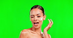 Face, moisturizer and playful with a woman on green screen, winking or kissing during beauty and skincare. Portrait, skin and comic with an attractive young female on mockup to apply lotion