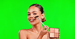 Beauty, makeup and brush for woman portrait on green screen background for cosmetic glow. Aesthetic female model laugh for skin and facial powder palette product shine for skincare mockup in studio