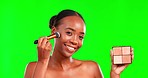 Makeup, face and black woman with blush in a studio for a natural, beauty and cosmetic routine. Cosmetology, brush and portrait of African female model with a facial cosmetics product by green screen