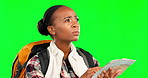 Lost, map or confused black woman on green screen reading directions on holiday, vacation or trip. Tourist, traveling or African female looking for help with on studio background with mockup space