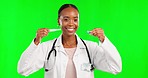 Healthcare, green screen and face of a doctor with a pregnancy test isolated on a studio background. Happy, showing and portrait of an African gynecologist giving a tutorial on a medical product