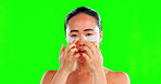 Skincare, face and Asian woman with eye patches on green screen in studio isolated on a background. Dermatology portrait, cosmetics and happy female model apply facial mask for healthy skin treatment
