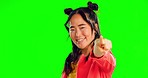 Asian woman, point and face in green screen studio for choice, mockup and happy with gen z fashion. Japanese, girl and smile in portrait with mock up space with hand gesture, excited and show sign