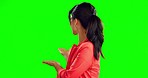 Showing, mockup and face of an Asian woman on a green screen isolated on a studio background. Happy, branding and a portrait of a Japanese girl doing promotion, product placement and a presentation