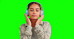 Green screen, headphones and woman listening to music isolated on studio background radio, dancing and calm. Gen z person dance with audio technology for streaming service promotion on mockup space