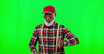 Dance, music and a mature black man on a green screen background in studio having fun moving with rhythm. Party, fashion and funky with a happy senior man dancing on chromakey mockup for freedom