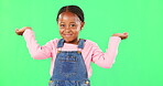 Little girl, face and clueless with smile on green screen for question against a studio background. Portrait of African American child or kid smiling with arms in air, unsure or doubt on mockup