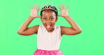Children, playful and princess with a black girl on a green screen background in studio feeling silly or goofy. Kids, cute and happy with an adorable little girl playing or having fun on chromakey