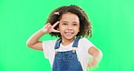 Smile, face and kid with peace sign on green screen in studio isolated on a background. Portrait, emoji and wink of happy mixed race child or girl with v hand gesture or symbol for happiness or joy.